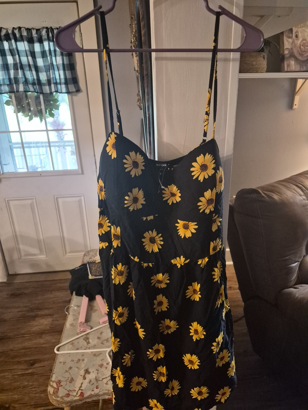 New Look sunflower-printed black cami dress features adjustable spaghetti straps